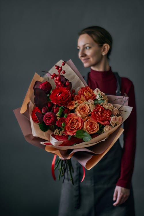 Free Florist Holding a Beautiful Flower Bouquet Stock Photo