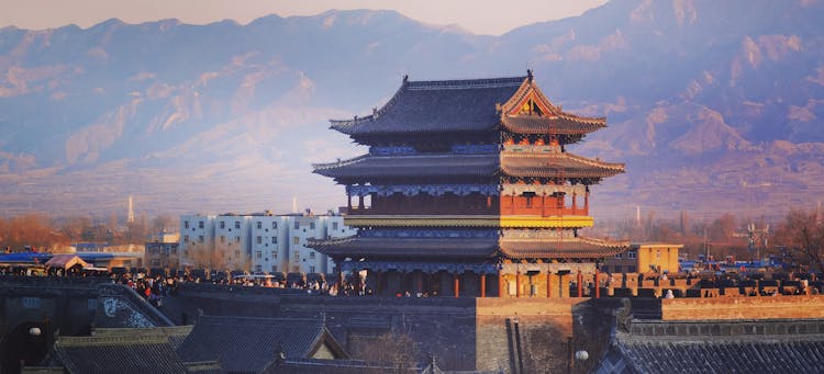 A Brown Building Near Mountains