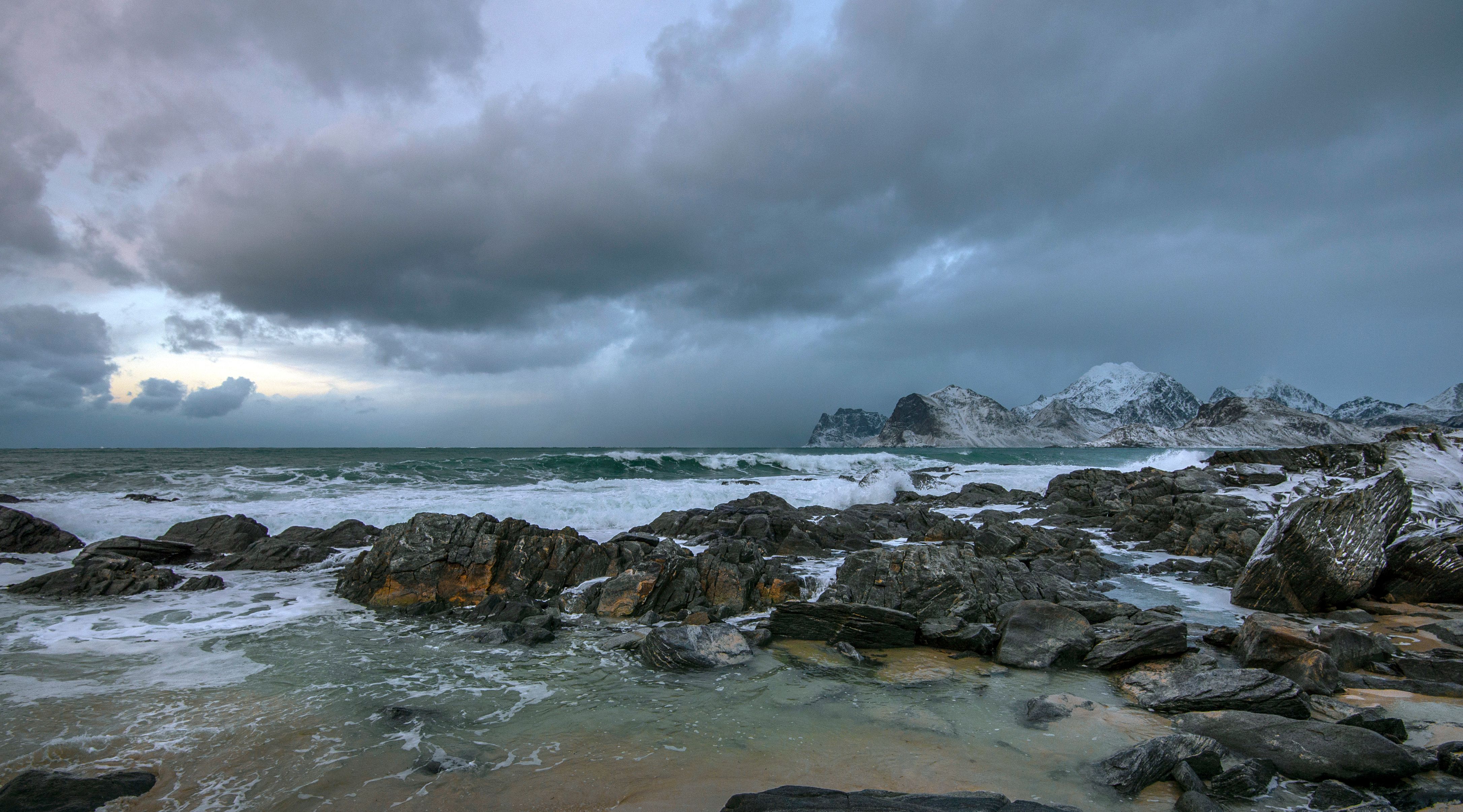Rocks on the Sea Under the Cloudy Sky · Free Stock Photo