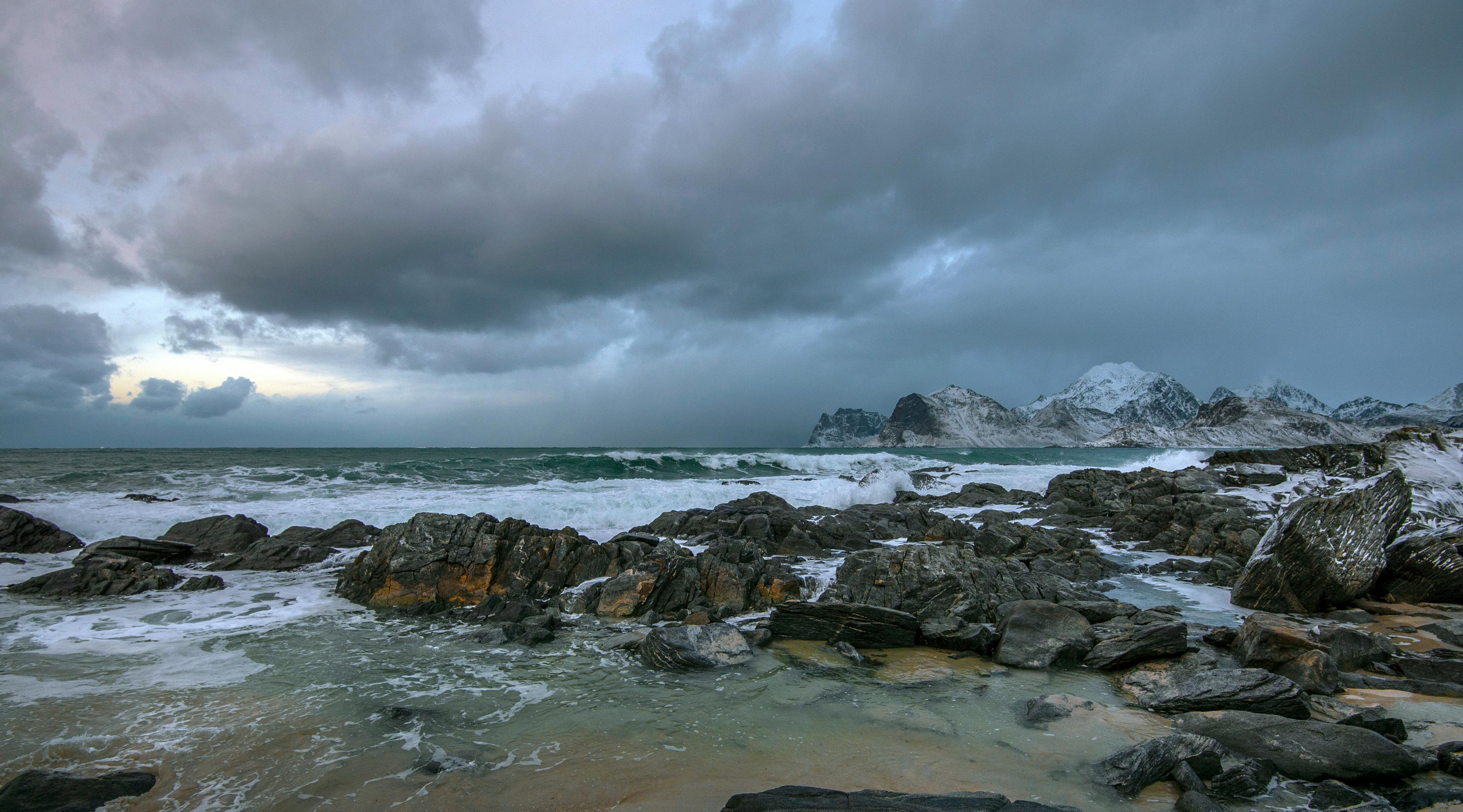 Light Rain and Mountain Snow Linger Over Northwest and Northern Rockies