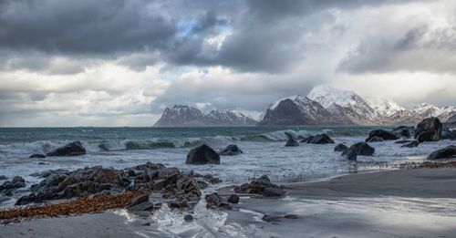 Free Stunning winter seascape of Myrland, Norway with rugged coast and snowy mountains. Stock Photo