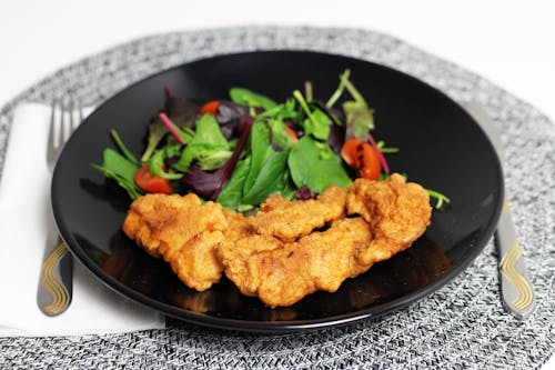 Close-up of Schnitzel with a Side Salad