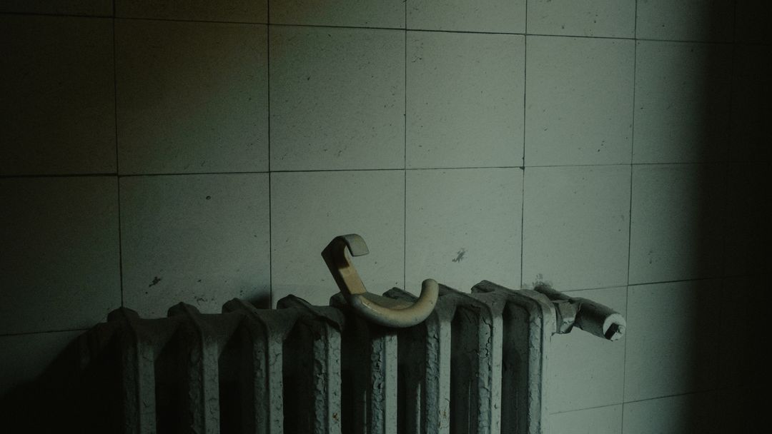 A heating unit under service. The number on the dial and the temperature at the tap are rarely the same thing.