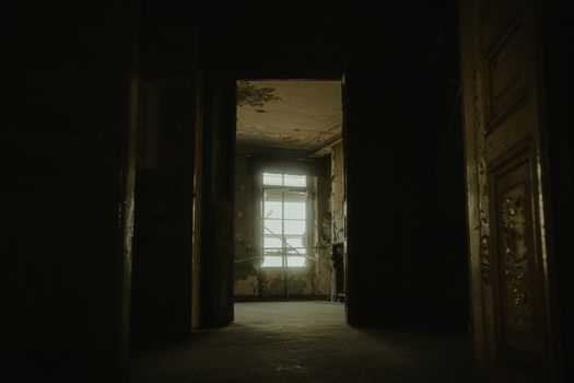 Explore the eerie interior of an abandoned building, capturing its desolate charm.