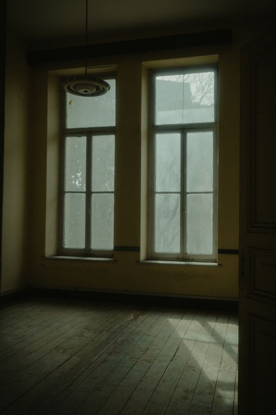 Empty room lit by a window