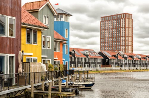 Colorful Houses by Water in Town
