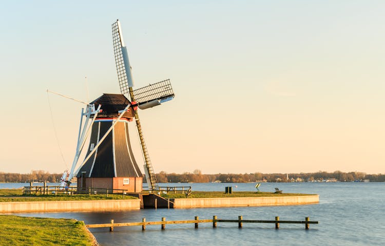 Wooden Windmill Near Water