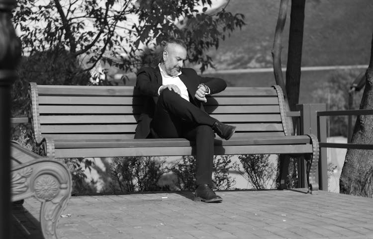 A Man Sitting On The Bench