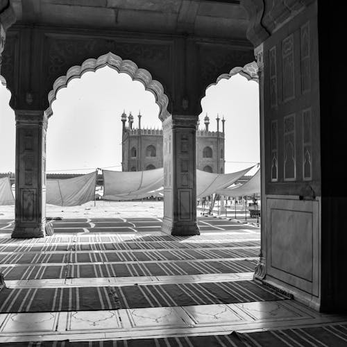 Courtyard of the Jama Masjid Mosque Seen through the Gate and Arches of Prayer Hall in New Delhi, India
