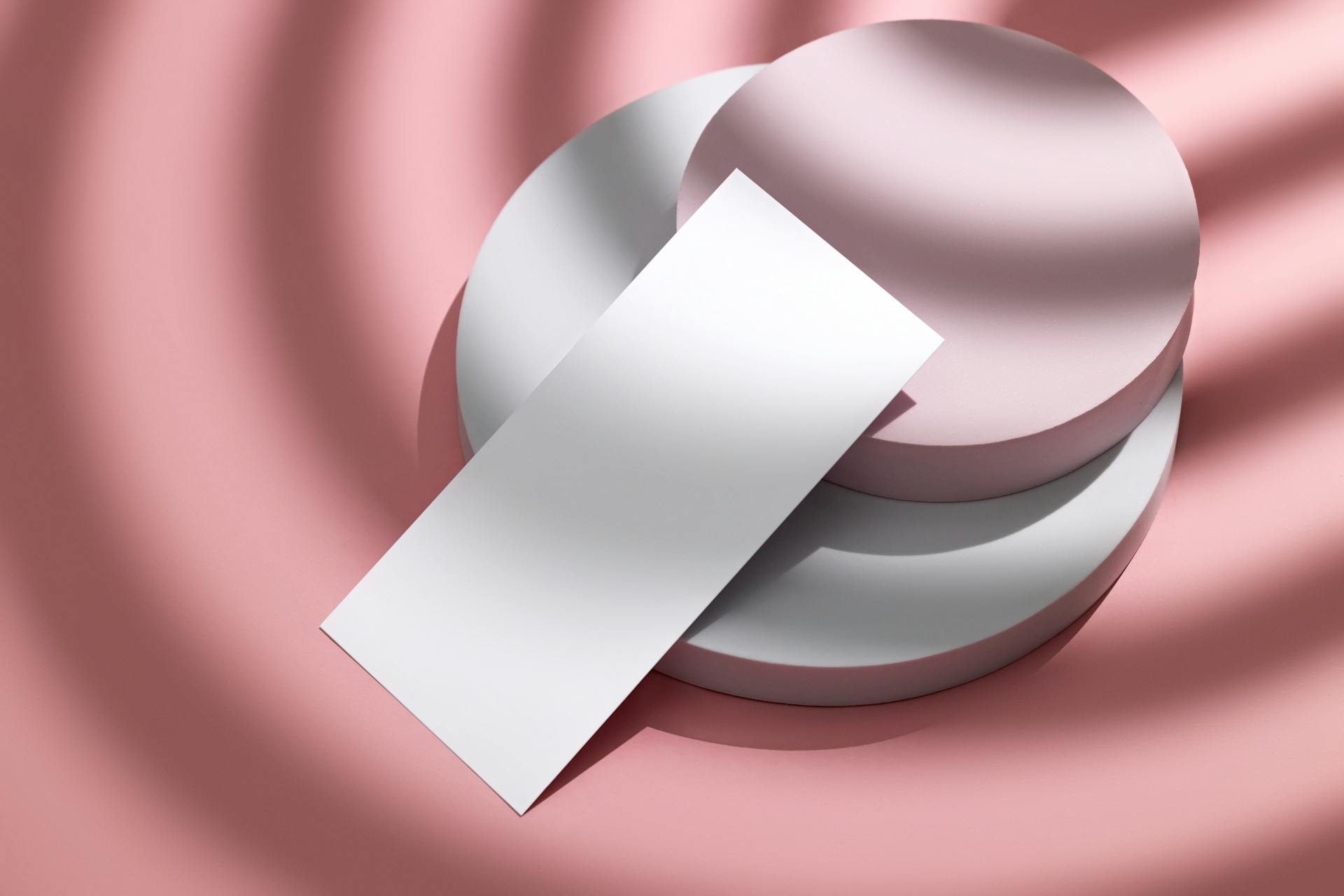 Paper Card Leaning against Round Blocks