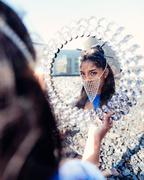 Woman Holding Ornamented Mirror