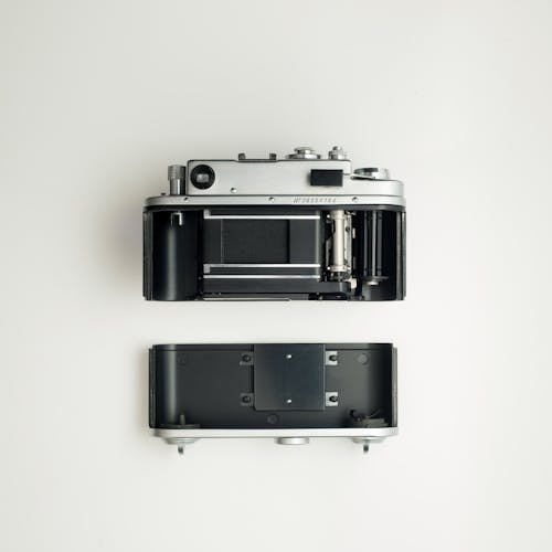 Free Black And Grey Camera On White Surface Stock Photo