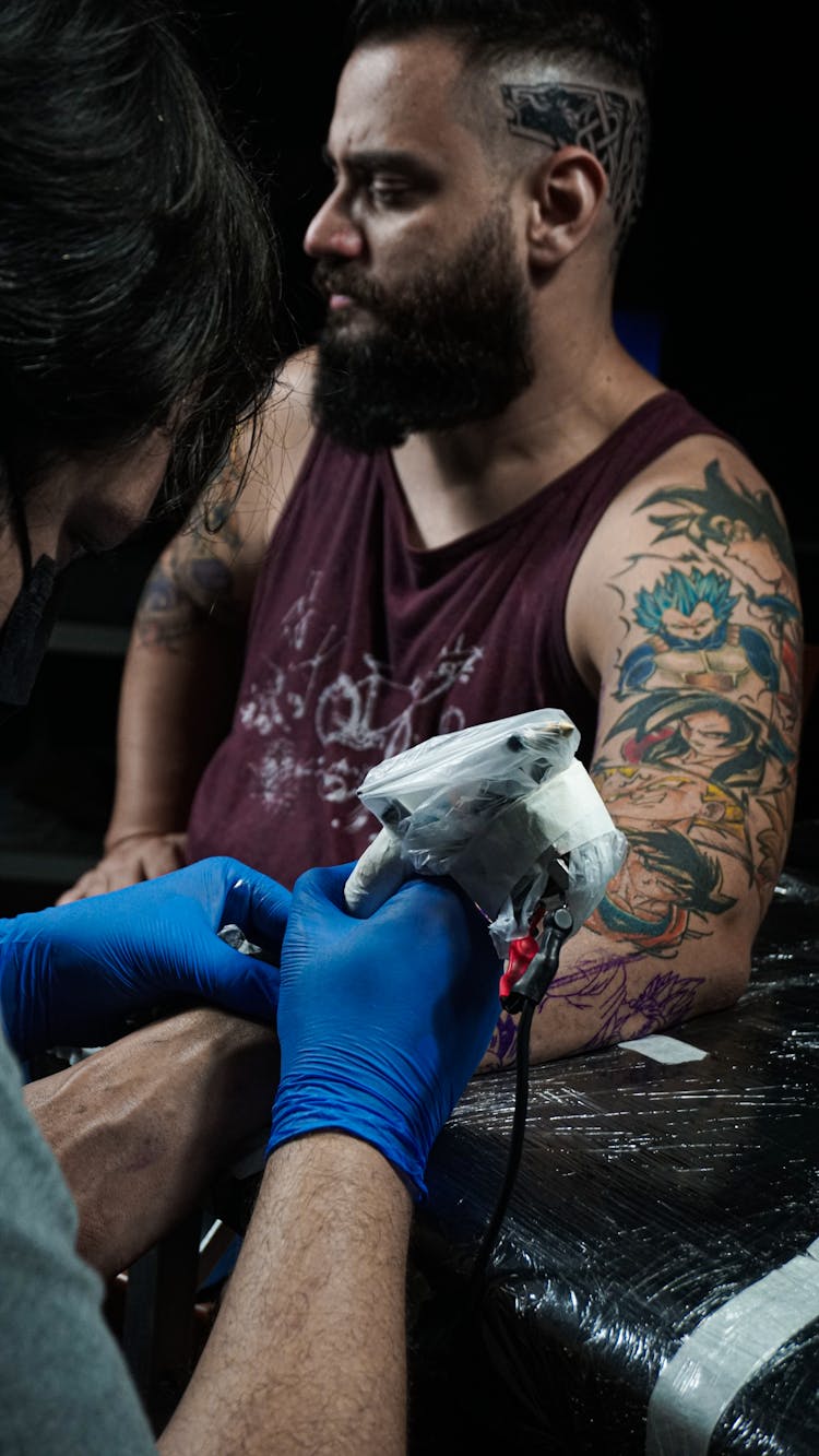 A Man Having A Tattoo