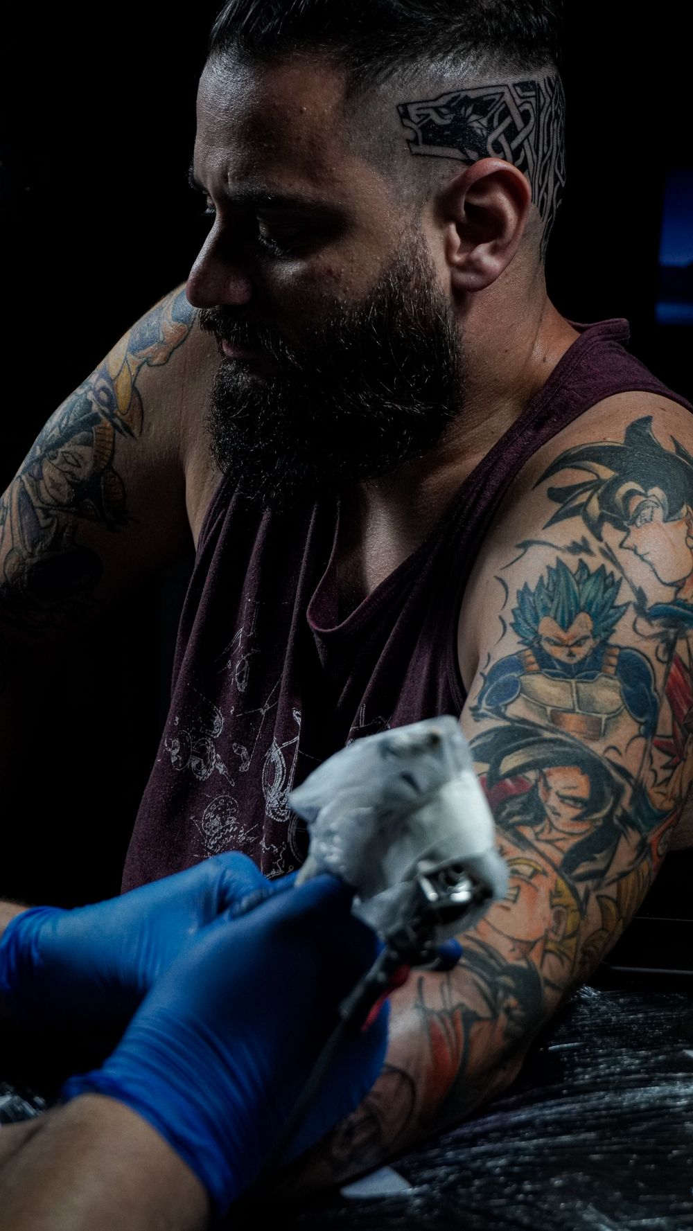 Heavily tattooed client mid-session at Thornvein
