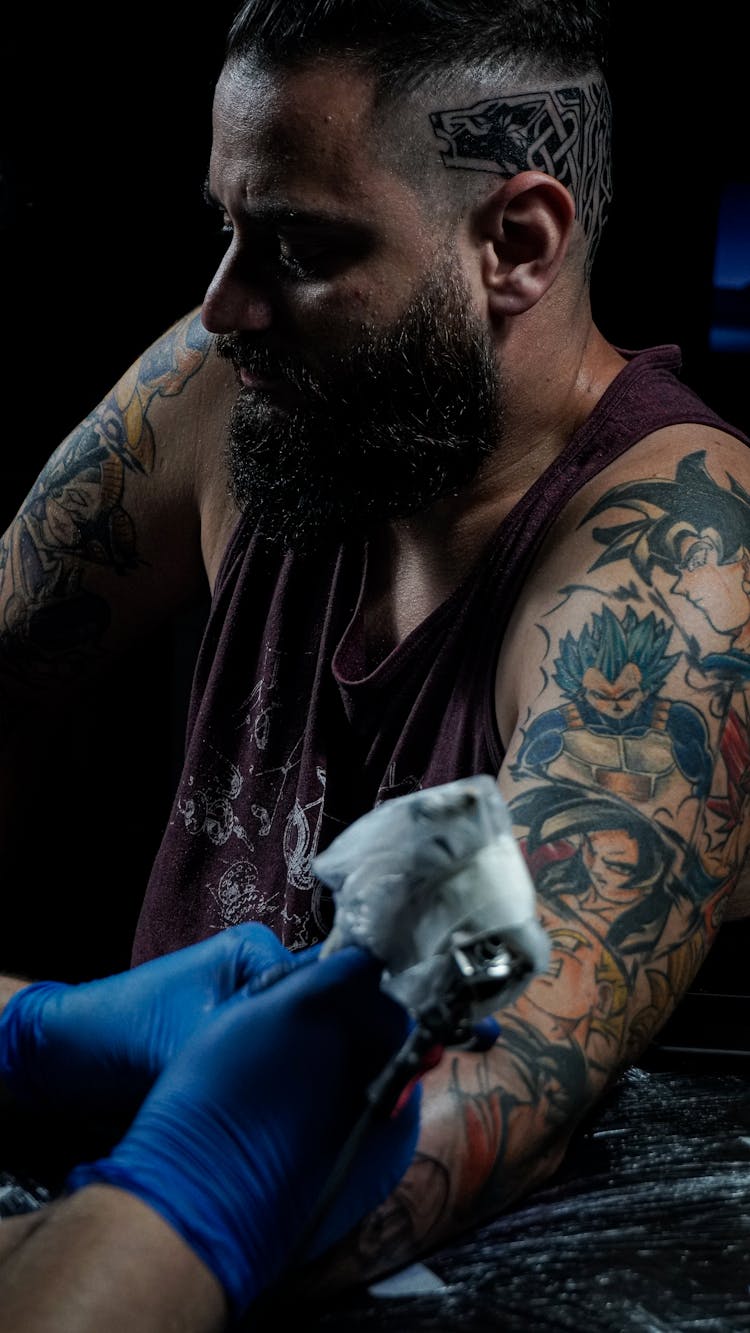 A Man Having A Tattoo