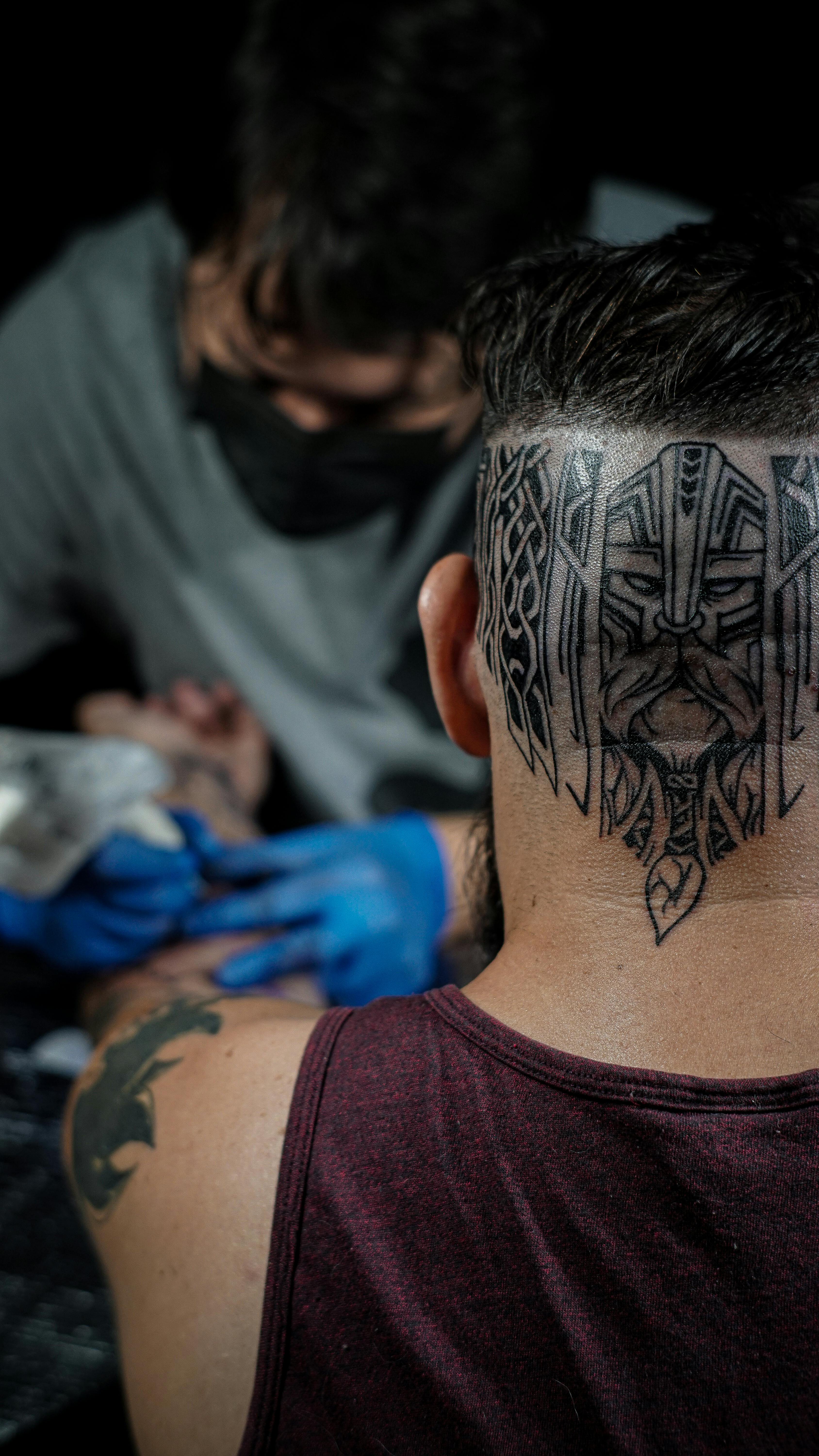 Back View of a Person with Head Tattoo · Free Stock Photo