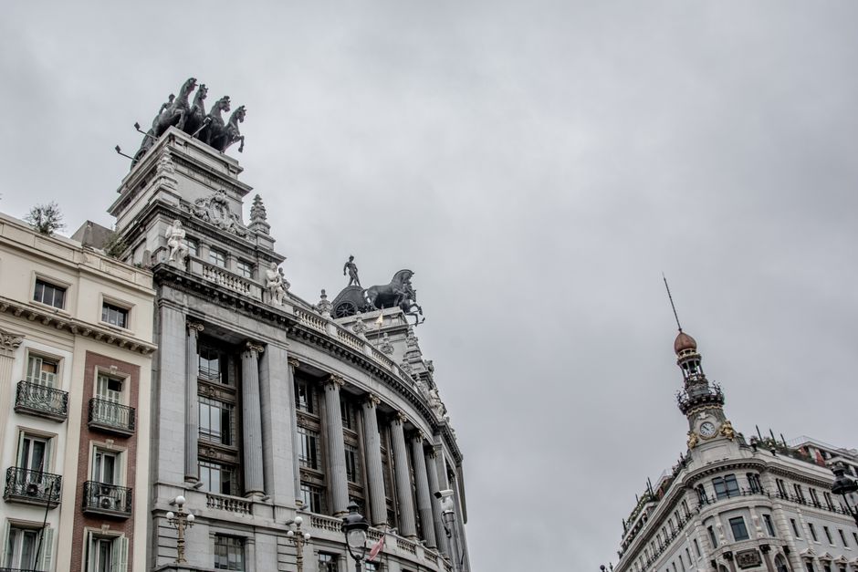Low angle view of classical architecture with sculptures in Madrid, Spain.