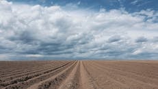 Brown Sand Under Blue Sky and White Clouds