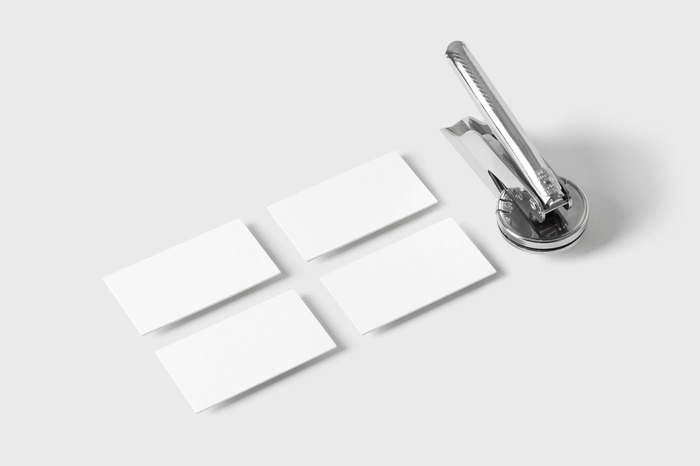 Embosser with stack of business cards on a workbench