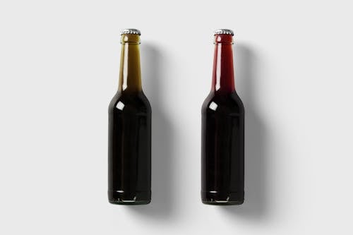 Free Glass Bottles on White Surface Stock Photo