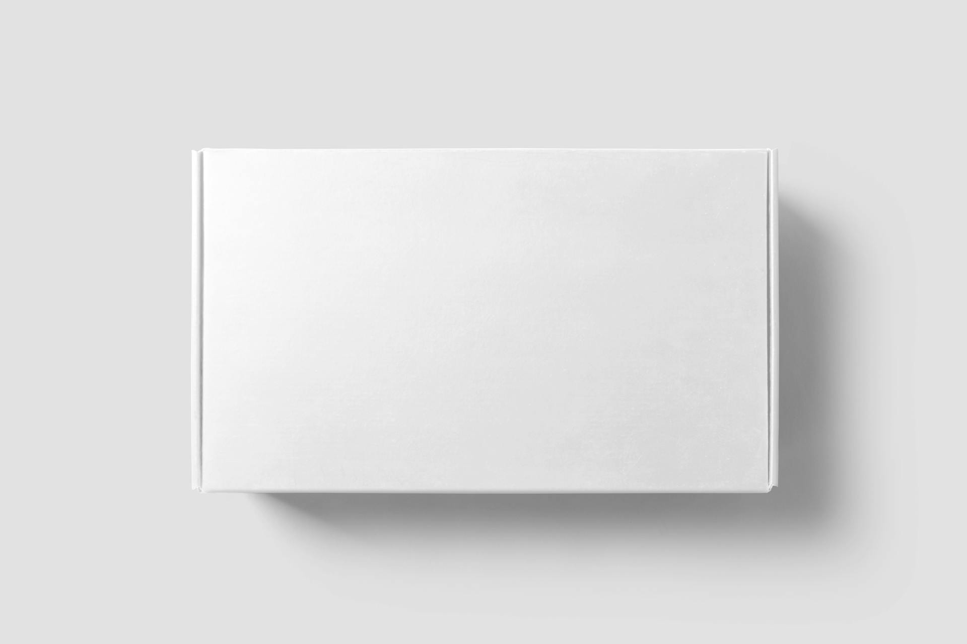 Simple minimalist image of a white cardboard box on a light gray background.