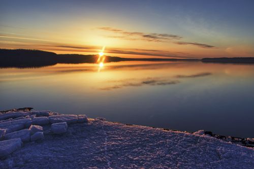 Free Capture of a serene sunrise over a frozen lake in Lake City, MN, showcasing nature's beauty. Stock Photo