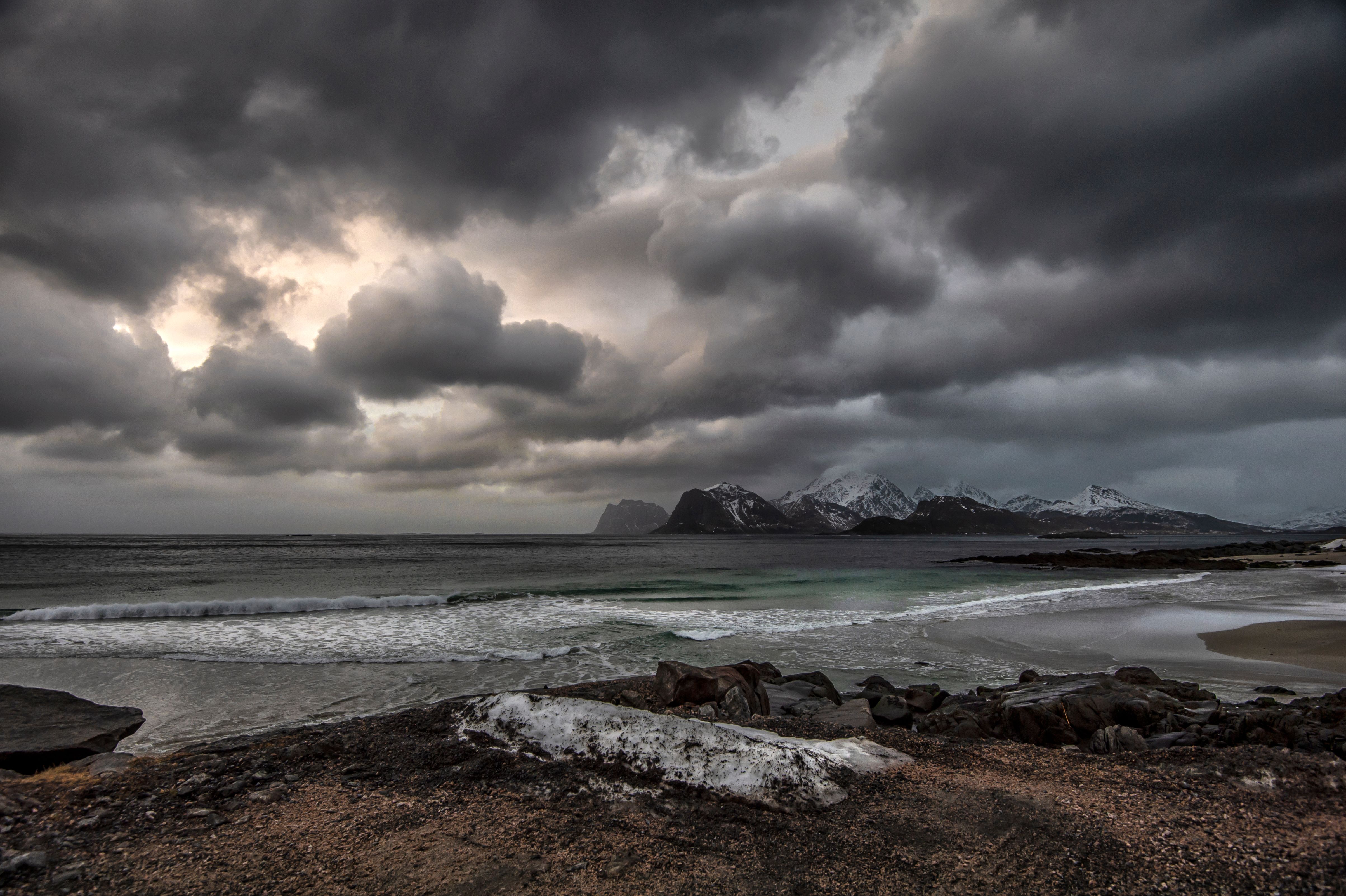 Gray Clouds Over a Dark Mountain · Free Stock Photo