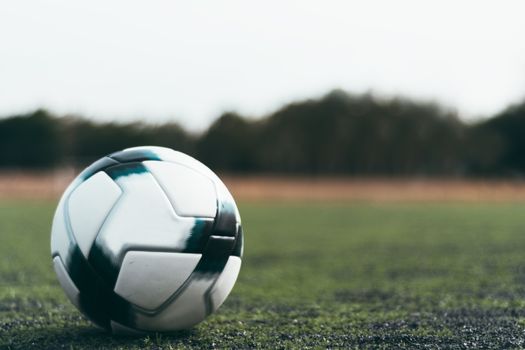 Soccer ball on a green field in Zapopan, Mexico, perfect for sports theme.