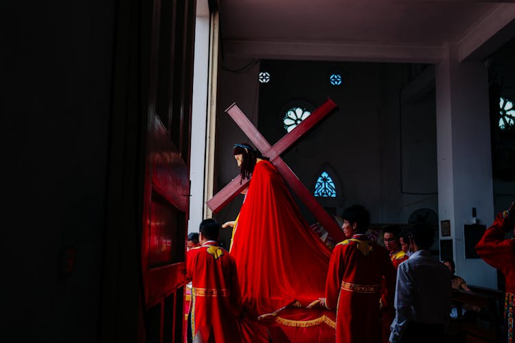 Children Carrying Jesus Christ Statue With Cross