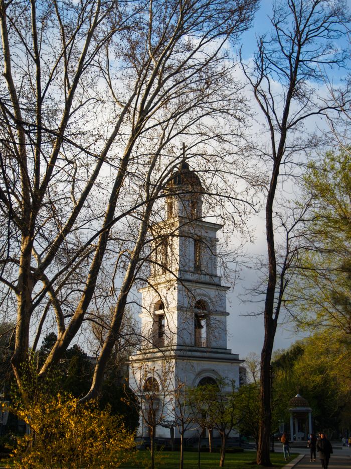 Cathedral of the Nativity bell tower framed by trees in Chișinău, the capital of Moldova