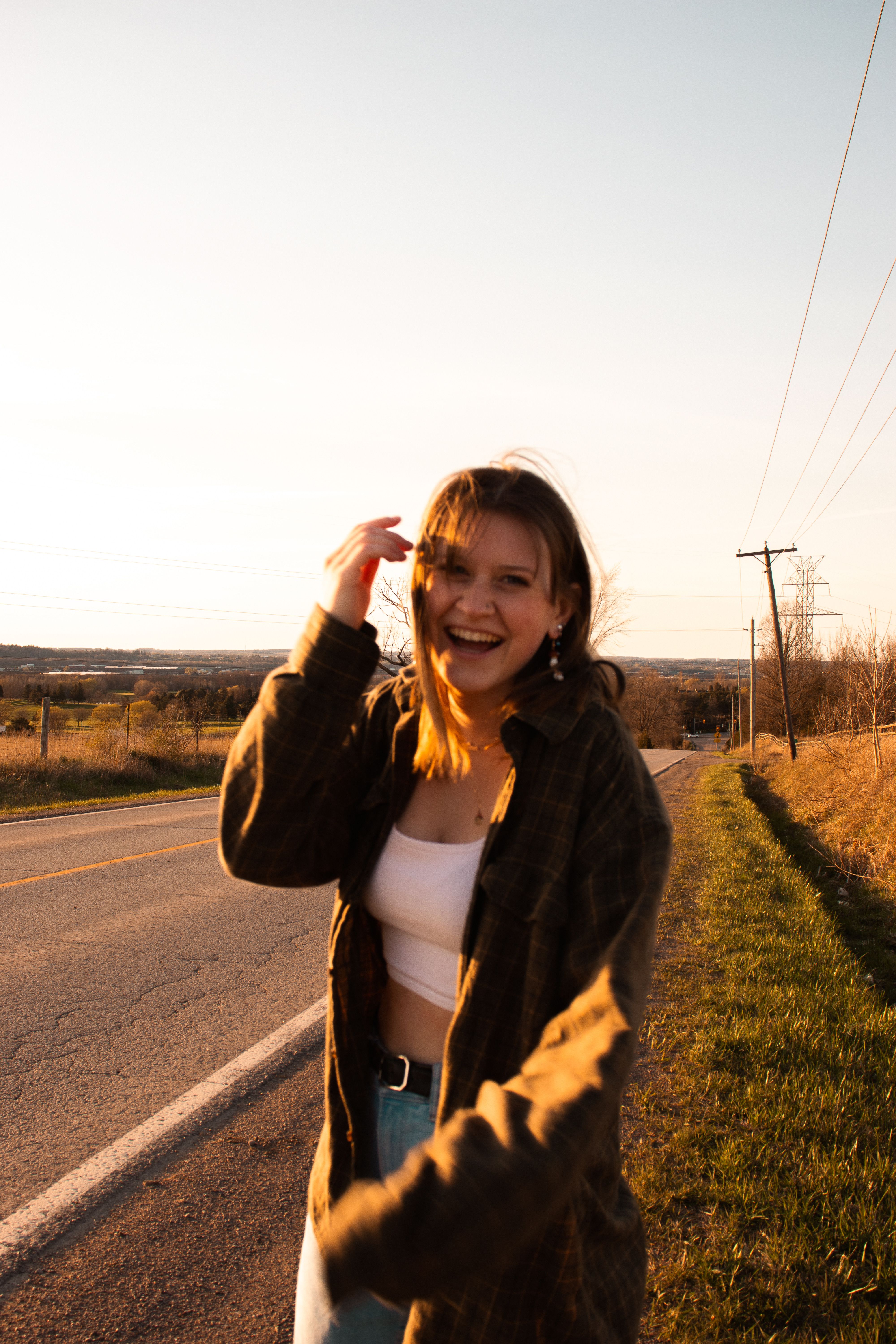 Woman in Black Jacket Standing on Road · Free Stock Photo