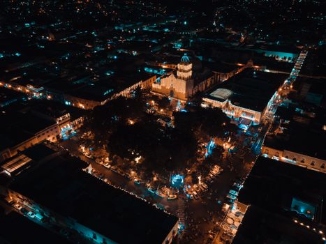 A stunning aerial view of illuminated Atlixco, Mexico at night during festive season.