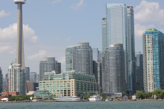 The iconic Toronto skyline featuring the CN Tower and modern skyscrapers by the water.