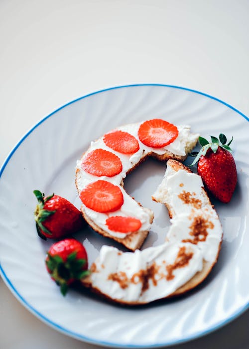 Sliced Strawberry on Bread on White Ceramic Plate