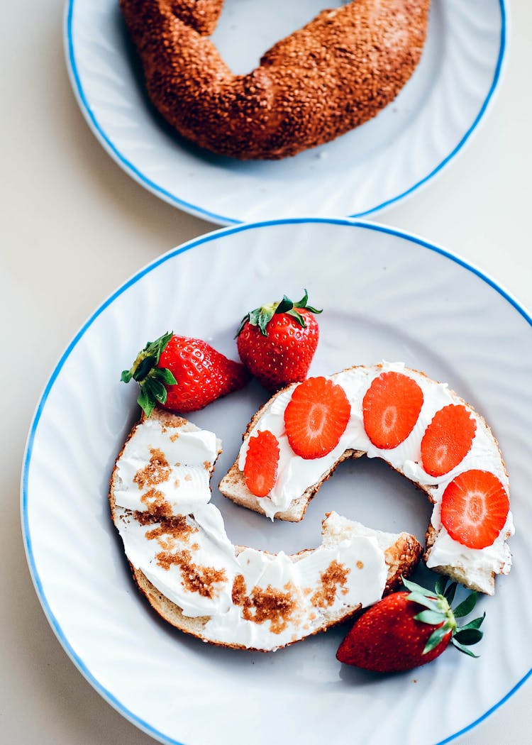 Sliced Bagel With Cream Cheese And Strawberries