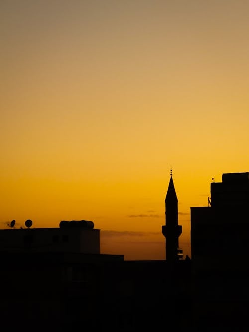 Foto profissional grátis de alvorecer, cair da noite, edifícios