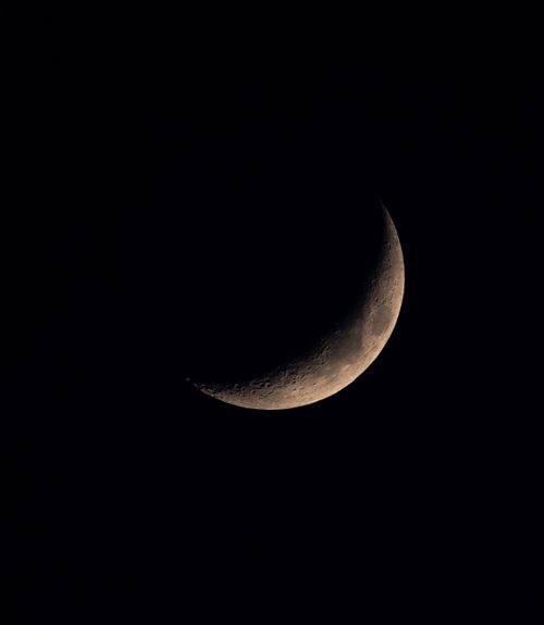Free A crescent moon prominently displayed against a dark night sky, ideal for astronomy enthusiasts. Stock Photo