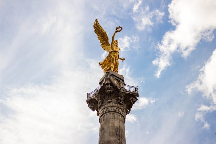 Winged Golden Statue On Monument