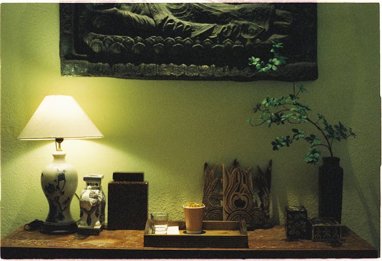 Hotel Interior With Green Wall And Lamp On A Desk