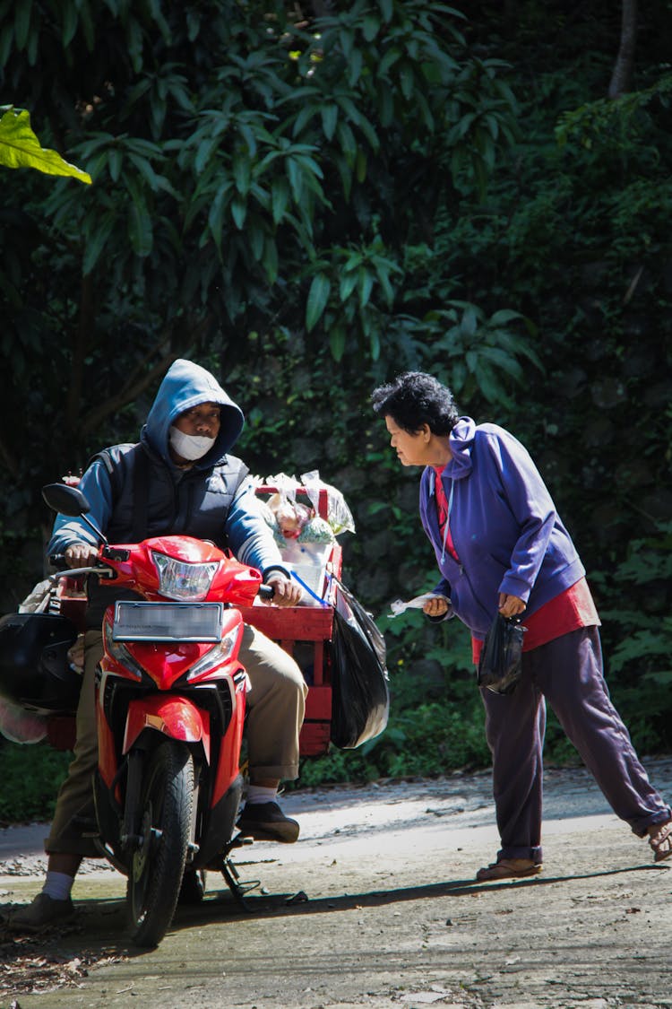 Men Talking Near Motorcycle