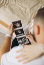 Man Watching Baby Ultrasound Scans