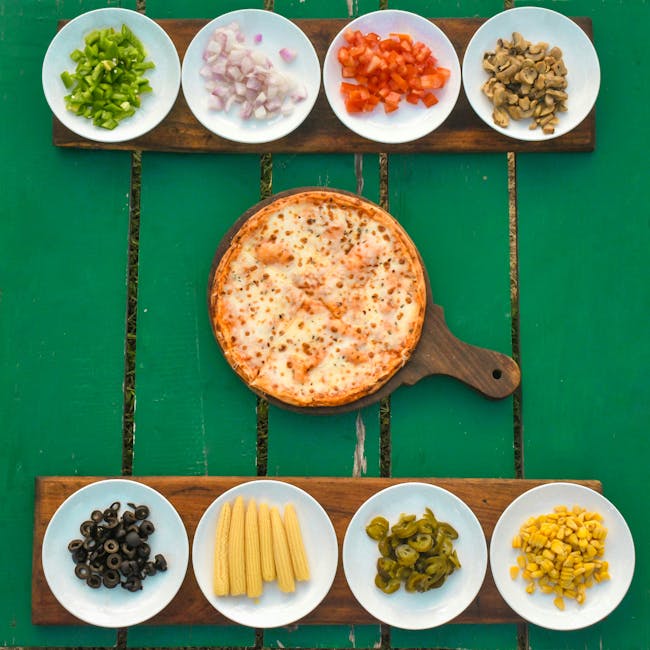 Mouth-watering pizza surrounded by fresh and colorful toppings, ready for a delightful meal.