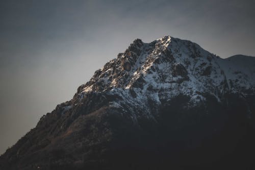 Low-Angle Shot of a Snow-Covered Mountain