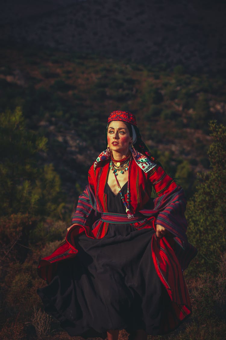 Woman In A Costume Running Up A Hill