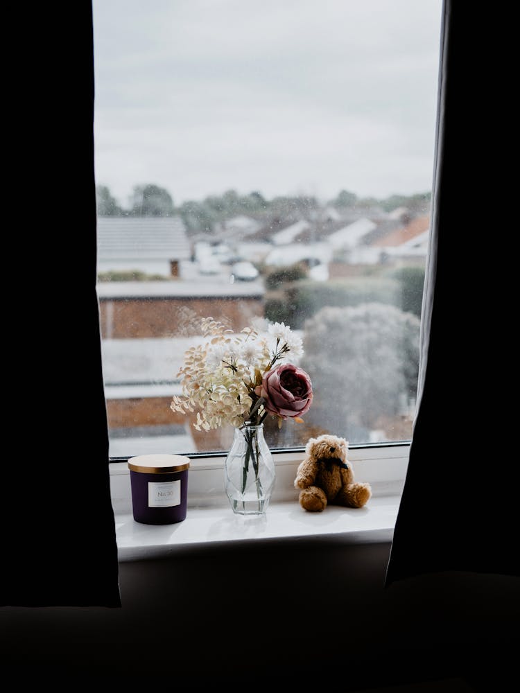 Flowers In Vase On Windowsill