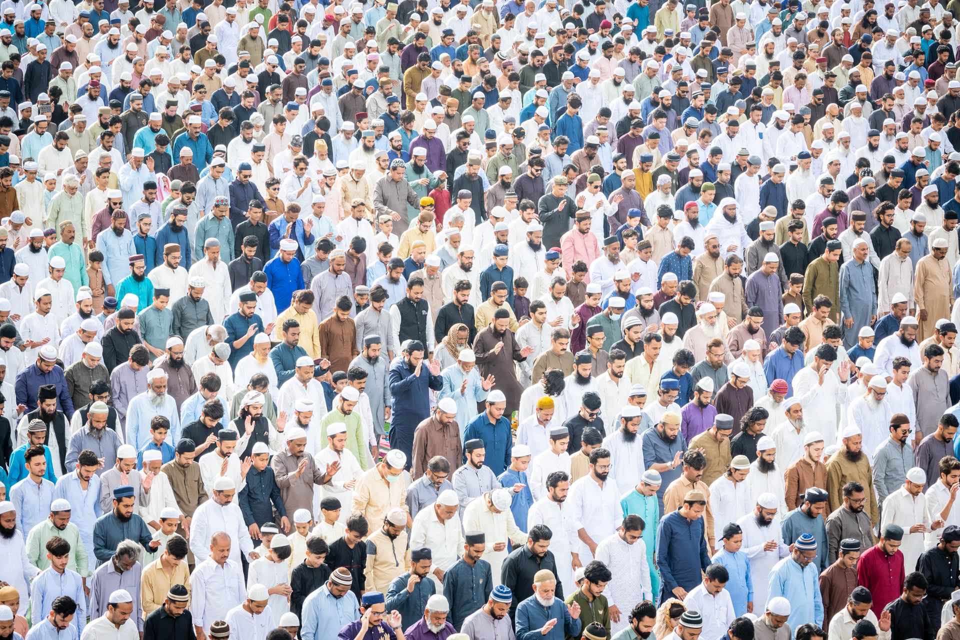 A large congregation praying together