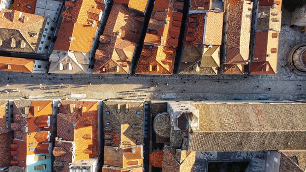 Aerial photograph showcasing the historic rooftops of Dubrovnik, Croatia, capturing the vibrant urban landscape.