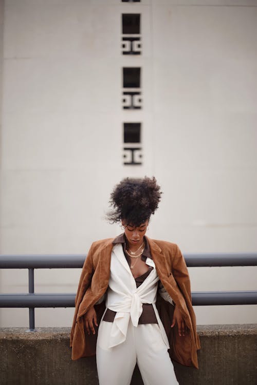 Free Woman in Coat Looking Down Stock Photo