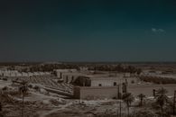 Explore the historic ruins of ancient Babylon under the expansive Iraqi sky.