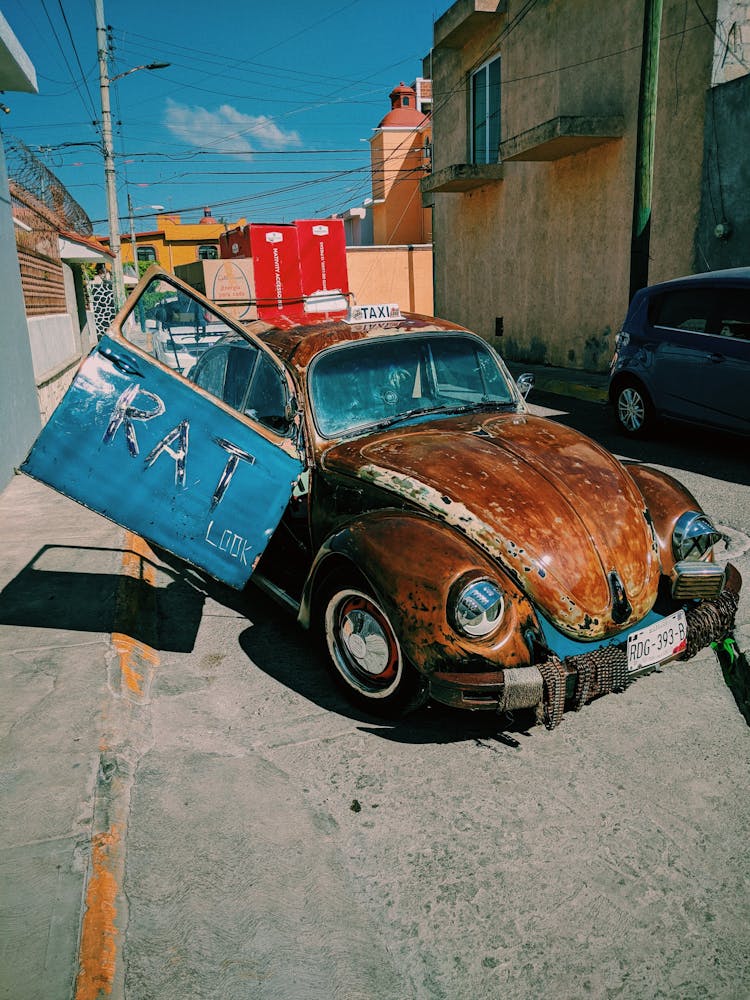 Old Taxi Car Painted Blue And Brown 